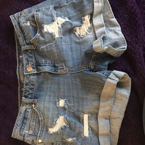 Jennifer Lopez dark blue jean short distressed